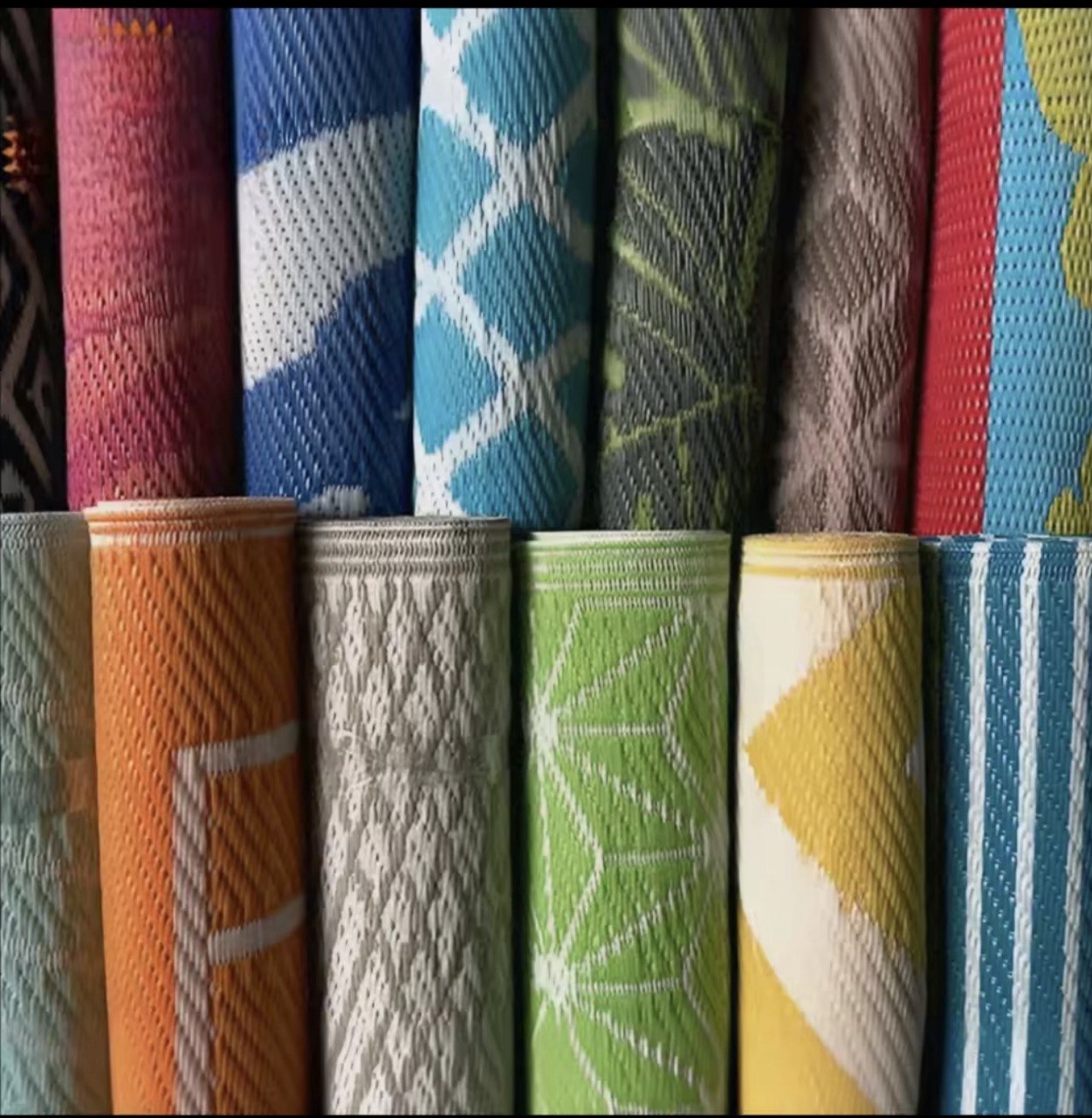 Stack of PP plastic mats in multiple colours and patterns