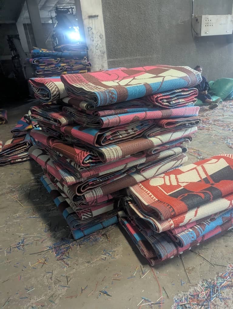 Folded PP plastic mats stacked in the warehouse