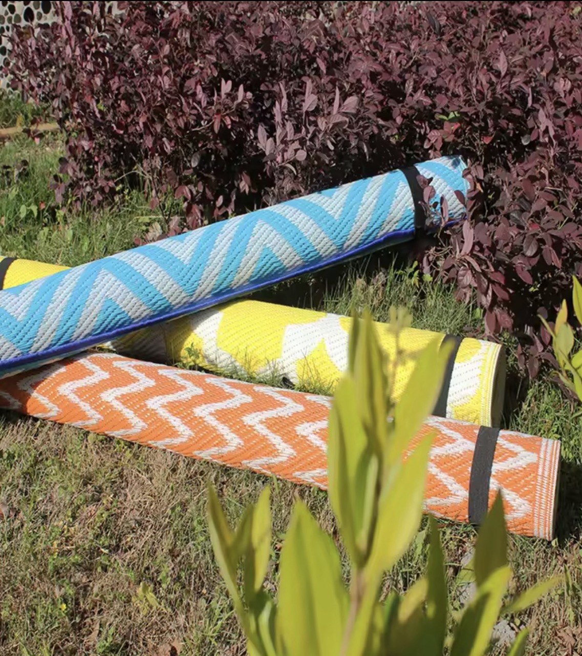 Three rolled PP plastic mats in chevron patterns
