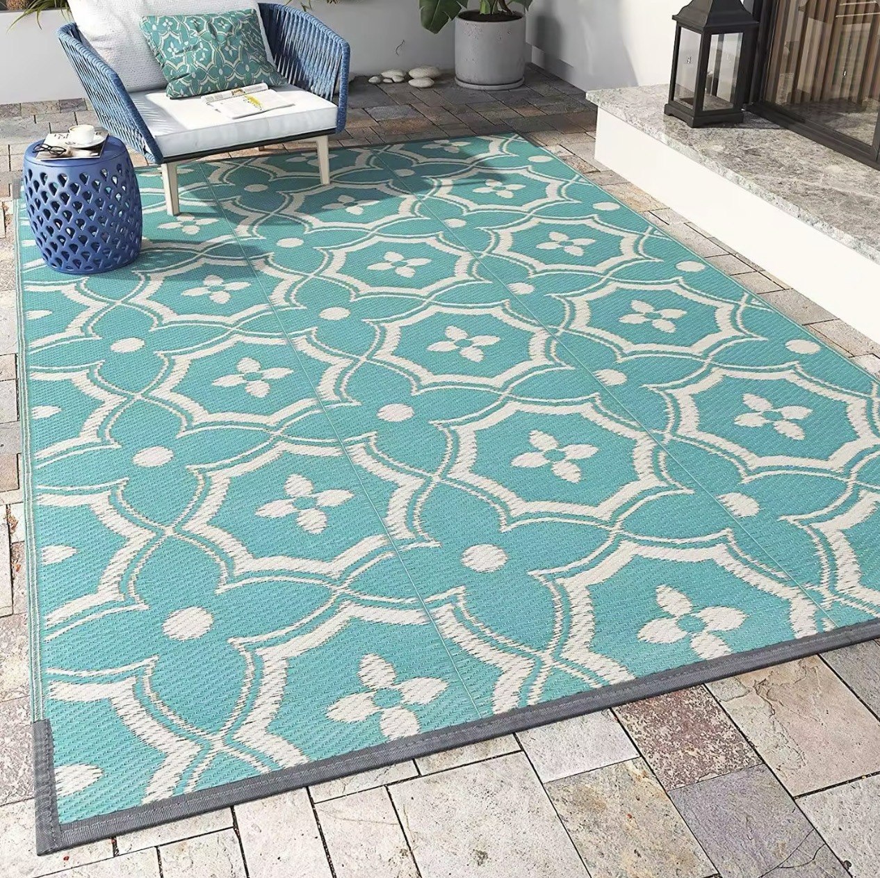 Woven PP plastic mat styled on a patio