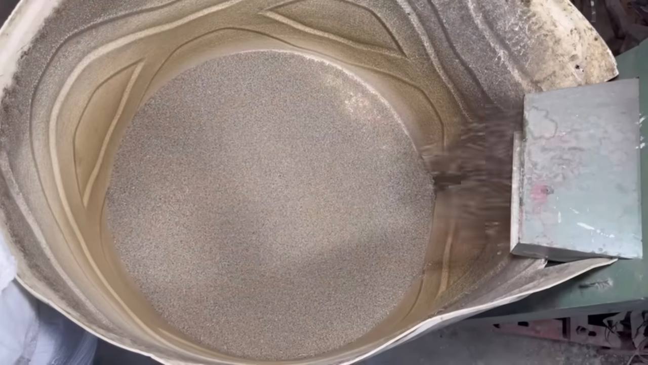 Plastic granules being mixed in a processing drum