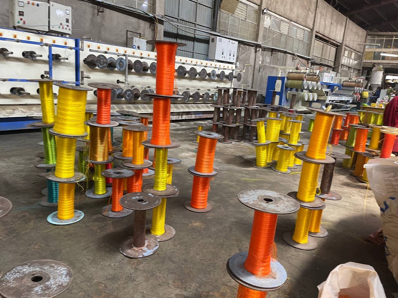 Rope spools stacked on the factory floor