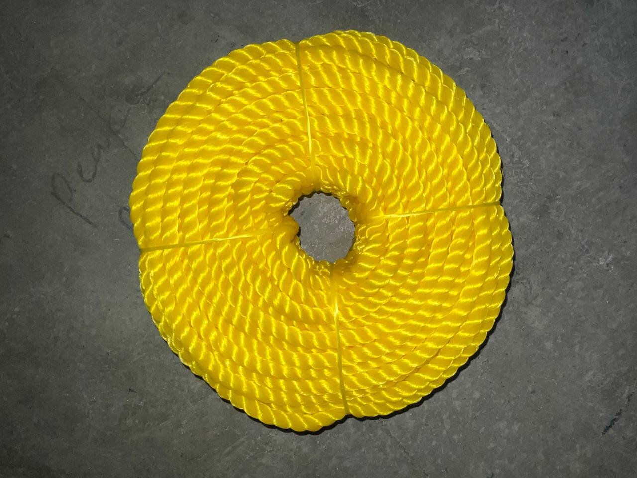 Rolled PP plastic mats outdoors on grass